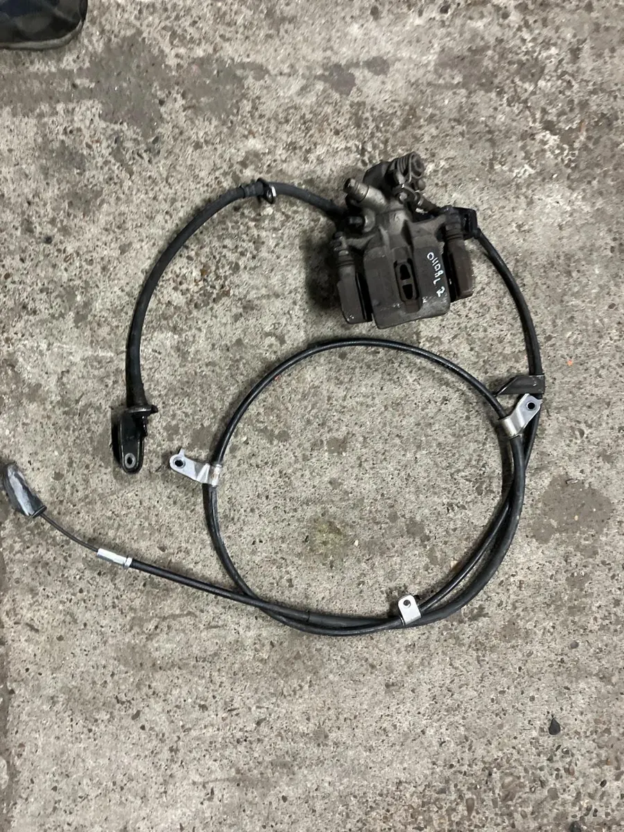 Суппорт тормозной honda civic 4d 8 R18 2008 задн. лев. (б/у)